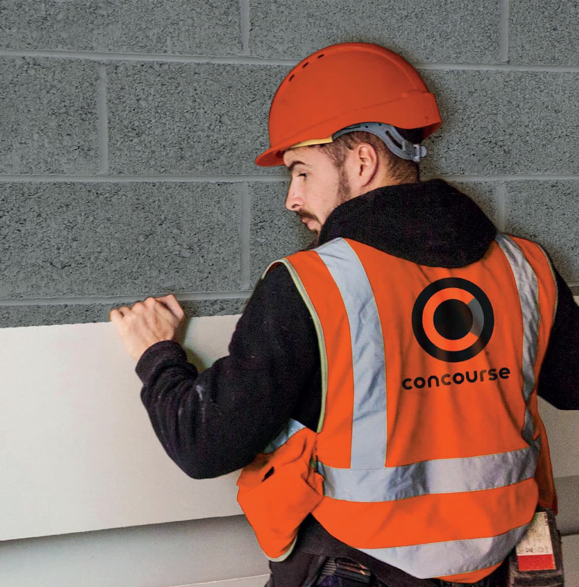 Concourse installer in branded hi-vis vest